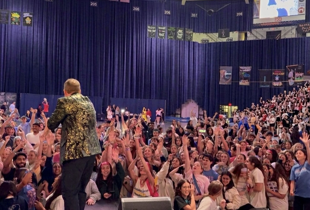 Richard Barker performing comedy hypnosis on stage