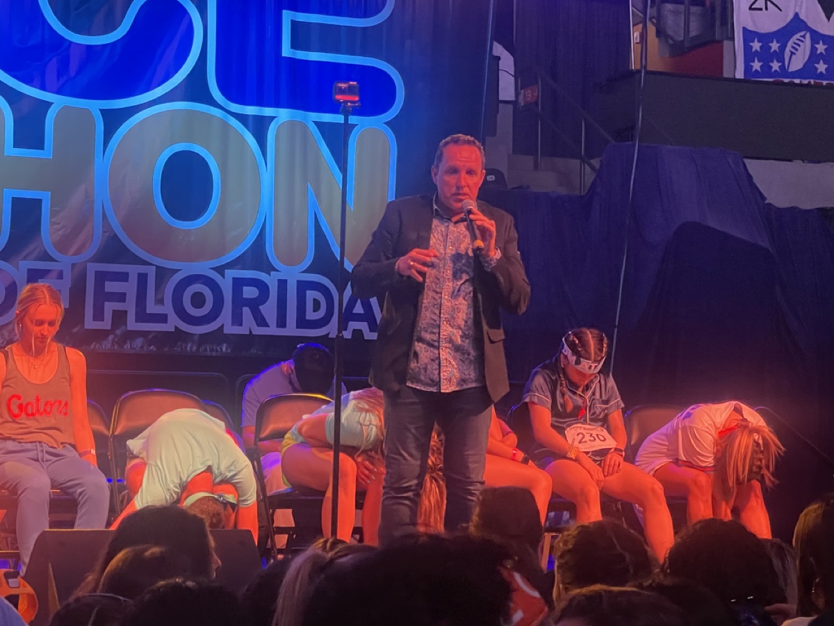 Richard Barker comedy hypnotist performing live on stage