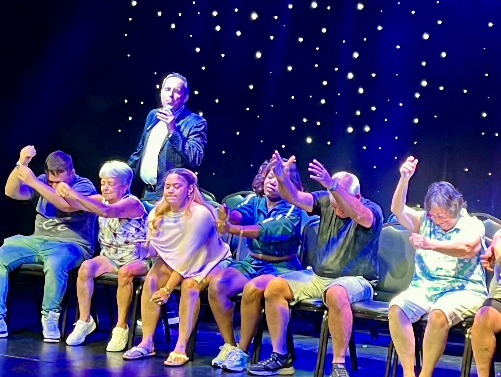 Volunteers cheering on stage