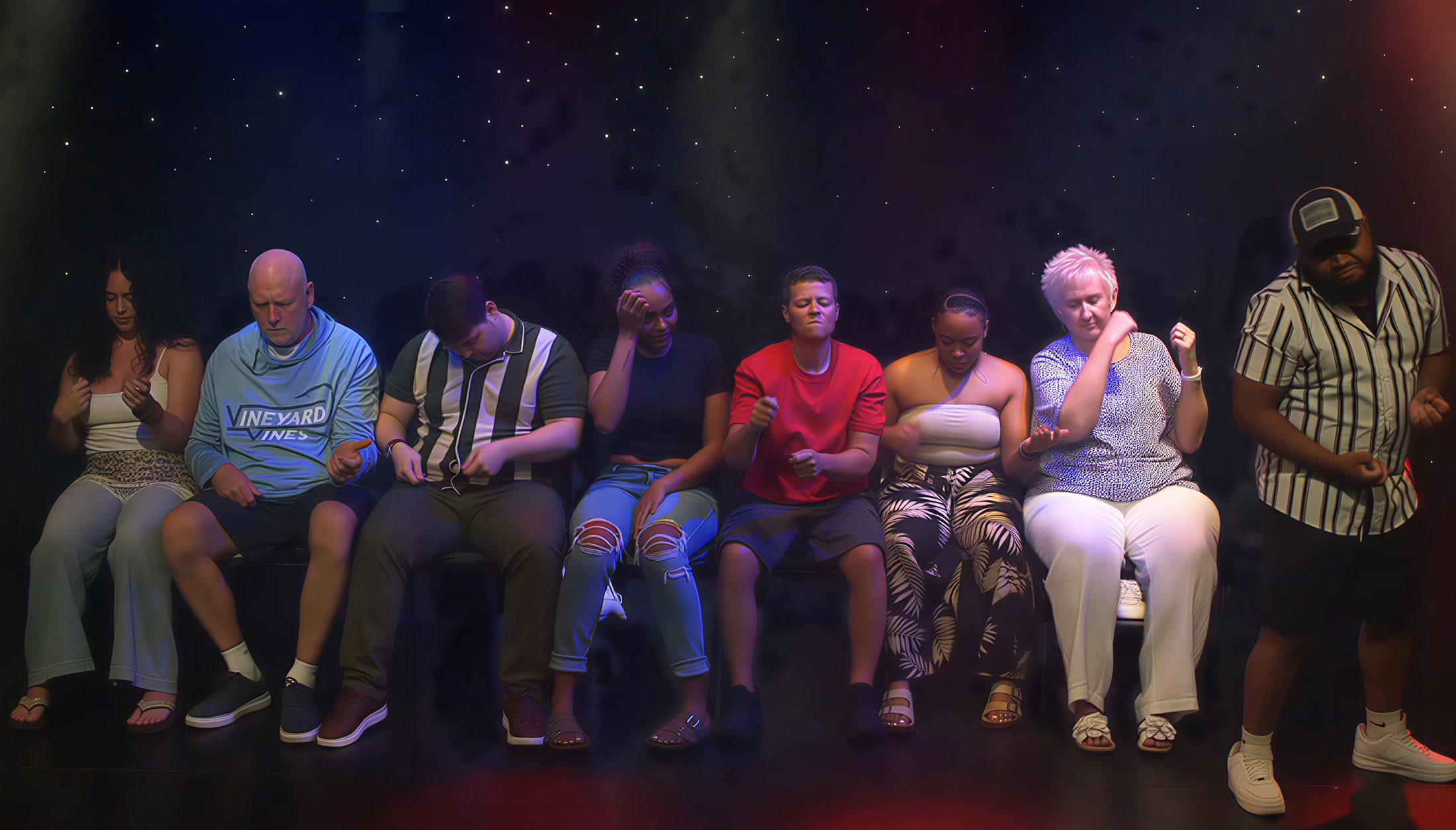 Volunteers dancing on stage under hypnosis