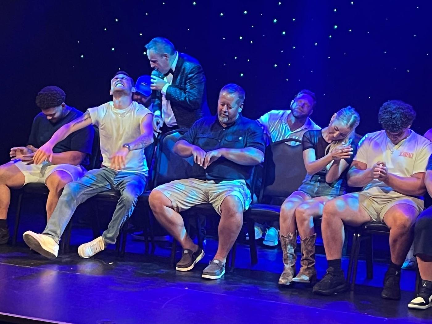 Hypnotized volunteers on stage